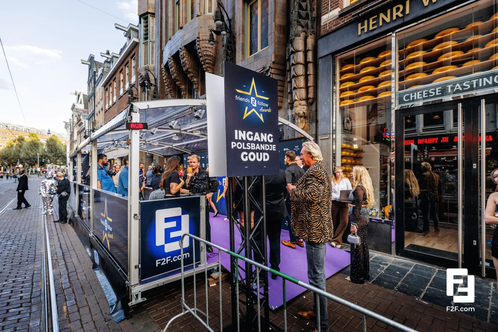 Guests checking in at the gold-wristband entrance of an invitation-only business event running on Pretix